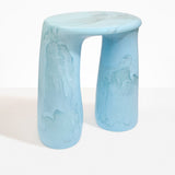 Dinosaur Designs Rock Tower Table in Pool — handcrafted marbled blue and clear resin side table with oval top and two chunky rounded legs..