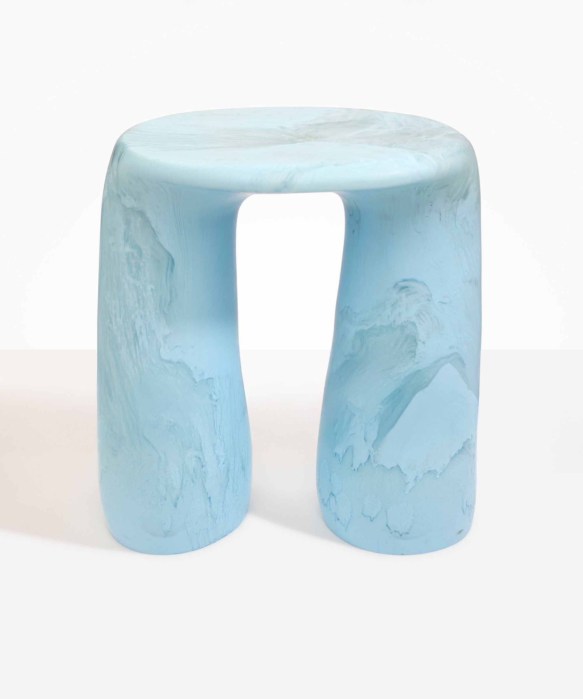 Dinosaur Designs Rock Tower Table in Pool — handcrafted marbled blue and clear resin side table with oval top and two chunky rounded legs