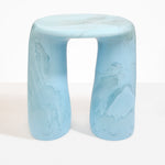 Dinosaur Designs Rock Tower Table in Pool — handcrafted marbled blue and clear resin side table with oval top and two chunky rounded legs..