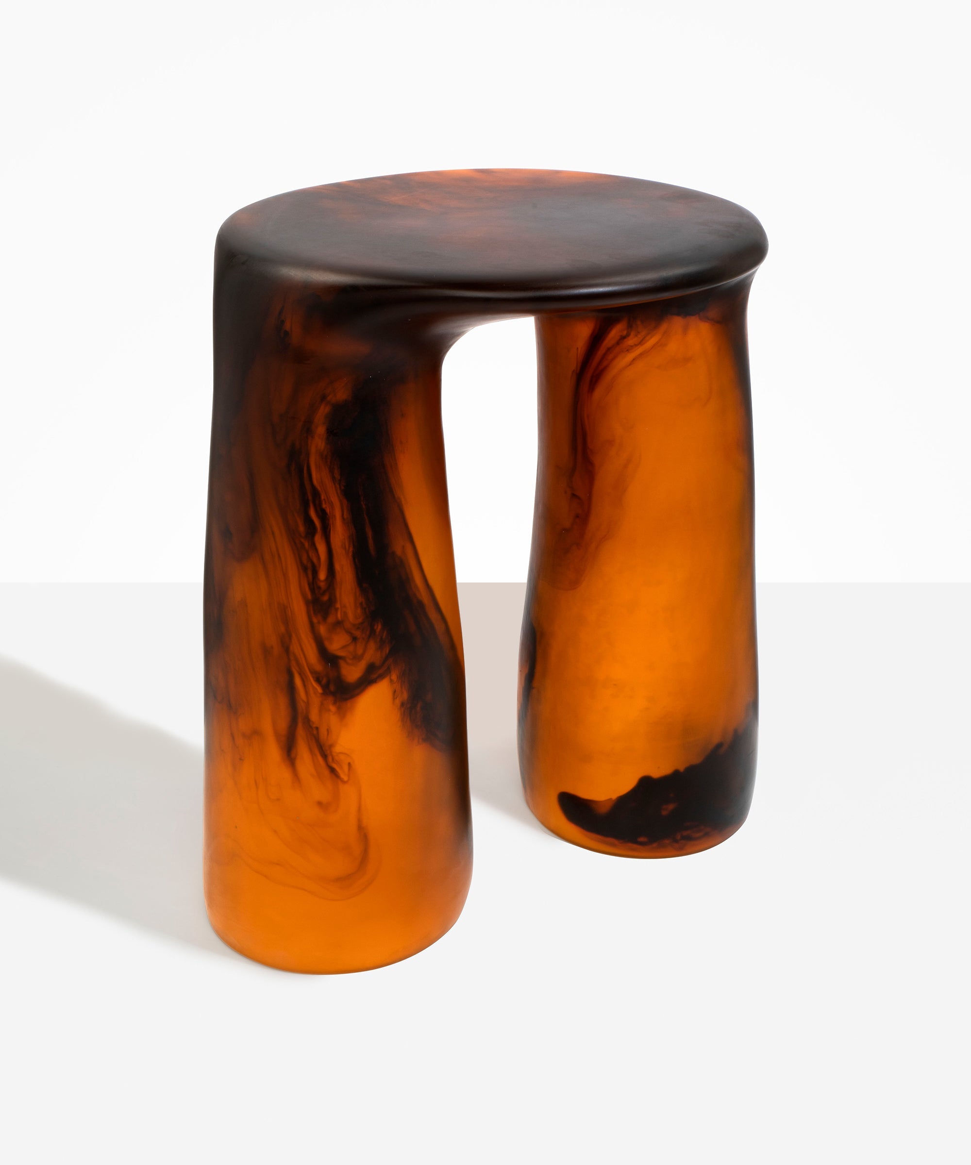 Dinosaur Designs Rock Tower Table in Tortoise — handcrafted marbled amber and black resin side table with oval top and two chunky rounded legs