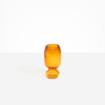 Dinosaur Designs Small Glass Rockpool Vase in Amber — handblown amber glass vase with rounded bulbous body and small spherical pedestal base..