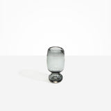 Dinosaur Designs Small Glass Rockpool Vase in Clear Black — handblown transparent black glass vase with rounded bulbous body and small spherical pedestal base..