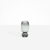 Dinosaur Designs Small Glass Rockpool Vase in Clear Black — handblown transparent black glass vase with rounded bulbous body and small spherical pedestal base..