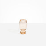 Dinosaur Designs Small Glass Rockpool Vase in Clear Brown — handblown transparent brown glass vase with rounded bulbous body and small spherical pedestal base..