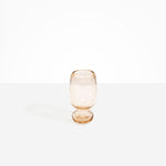Dinosaur Designs Small Glass Rockpool Vase in Clear Brown — handblown transparent brown glass vase with rounded bulbous body and small spherical pedestal base..