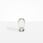 Dinosaur Designs Small Glass Rockpool Vase in Clear — handblown transparent glass vase with rounded bulbous body and small spherical pedestal base..