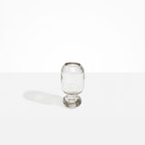 Dinosaur Designs Small Glass Rockpool Vase in Clear — handblown transparent glass vase with rounded bulbous body and small spherical pedestal base..