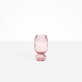 Dinosaur Designs Small Glass Rockpool Vase in Pink — handblown transparent pink glass vase with rounded bulbous body and small spherical pedestal base..