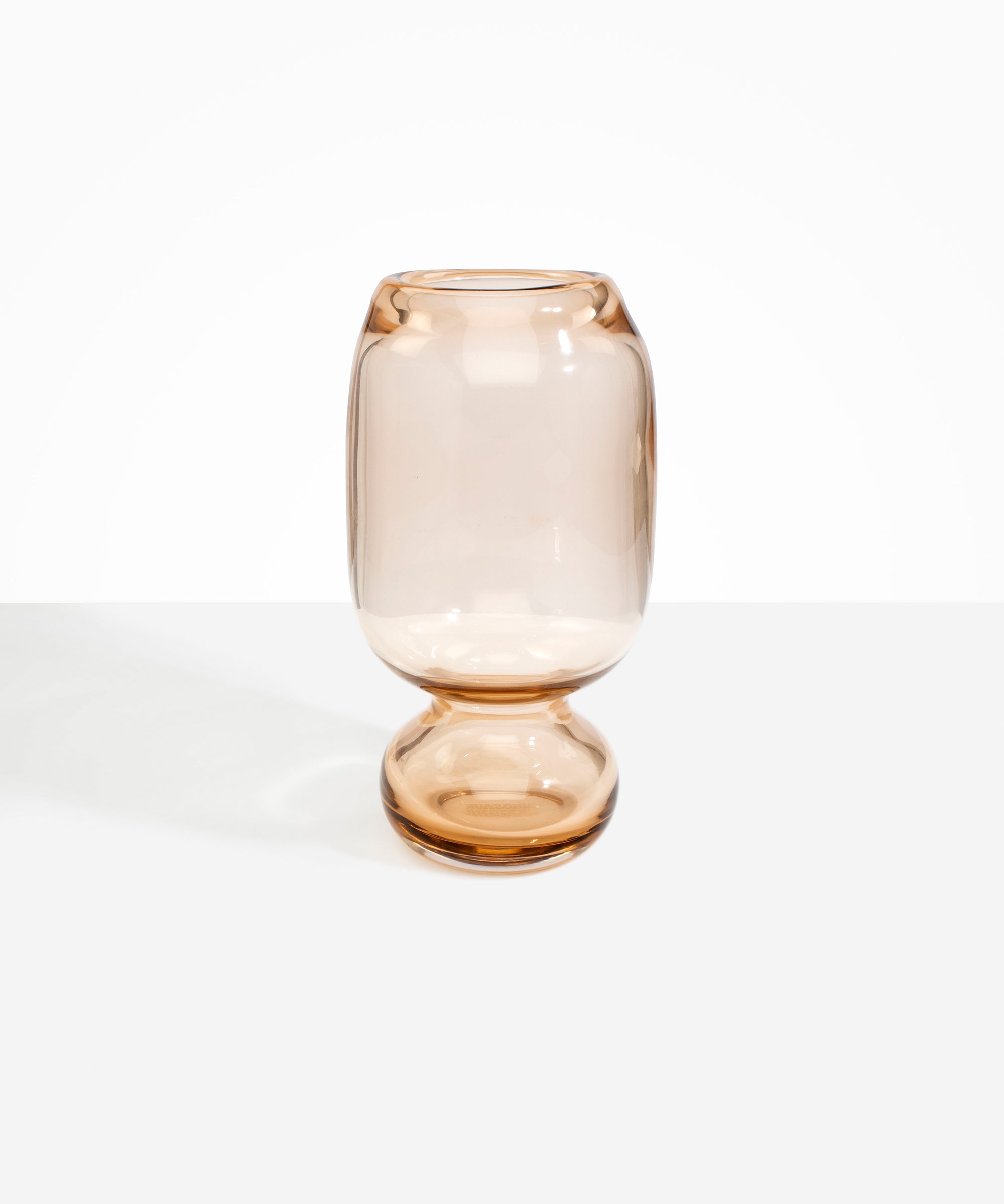 Dinosaur Designs Tall Glass Rockpool Vase in Clear Brown — handblown transparent brown glass vase with rounded bulbous body and spherical pedestal base..