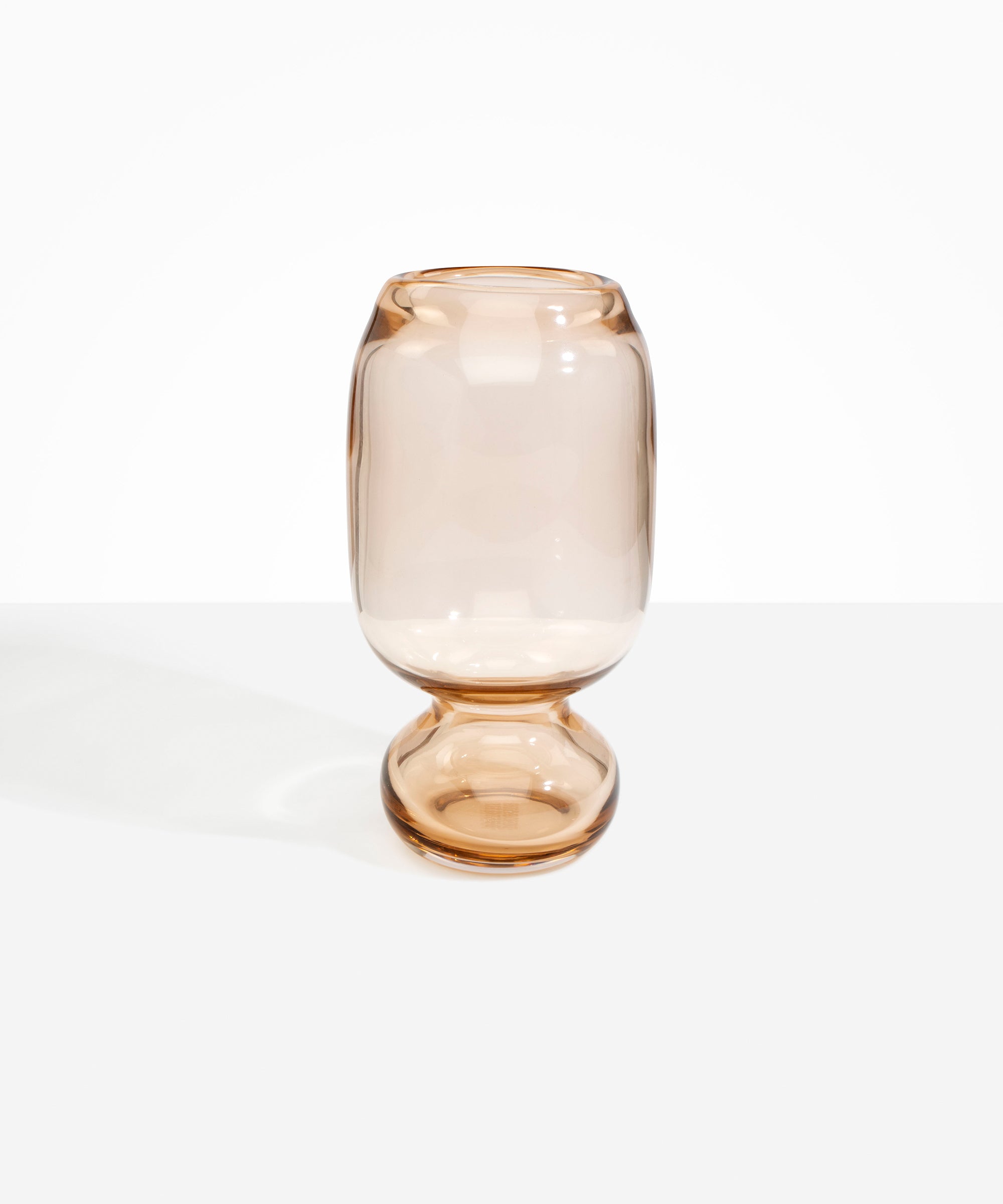Dinosaur Designs Tall Glass Rockpool Vase in Clear Brown — handblown transparent brown glass vase with rounded bulbous body and spherical pedestal base..