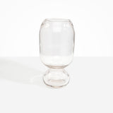 Dinosaur Designs Tall Glass Rockpool Vase in Clear — handblown transparent glass vase with rounded bulbous body and spherical pedestal base..
