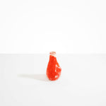 Dinosaur Designs medium sized Liquid vase in daisy red and cream colour resin