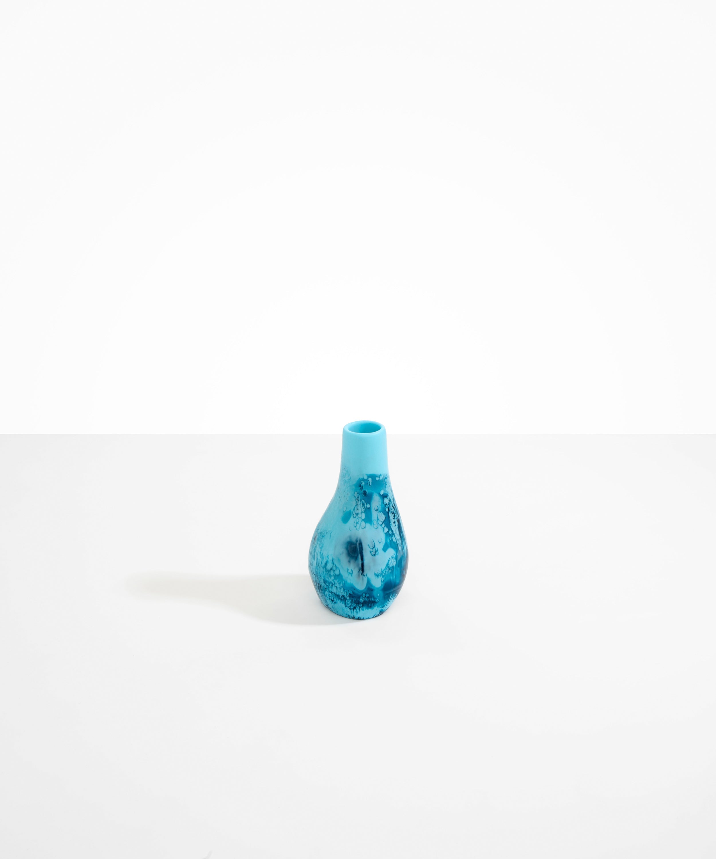 Dinosaur Designs medium sized Liquid vase in water blue colour resin..