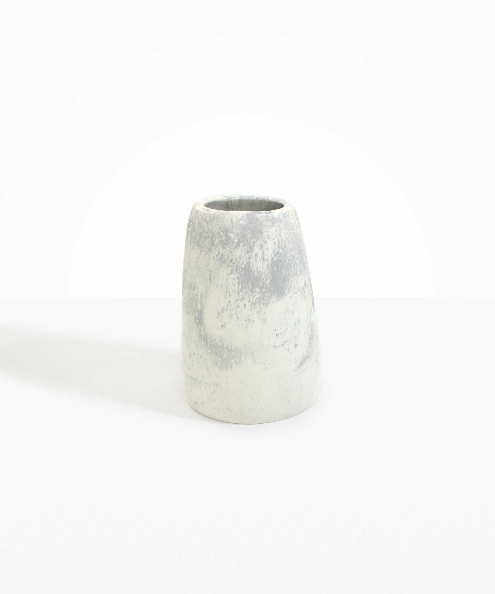 Dinosaur Designs Large Pebble Vase in Cloud — handcrafted marbled cream and grey resin vase with smooth rounded pebble form and narrow opening..