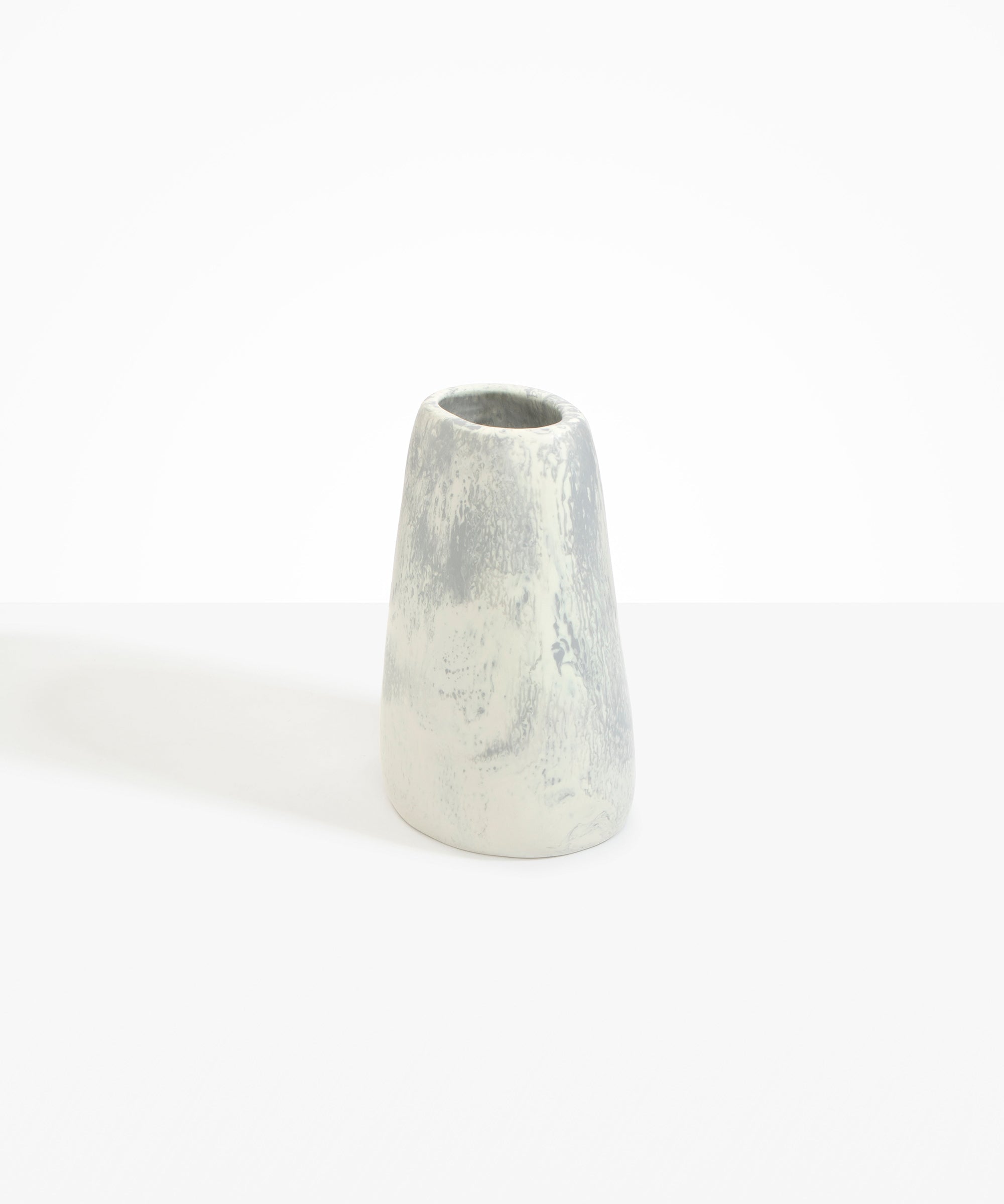Dinosaur Designs Large Pebble Vase in Cloud — handcrafted marbled cream and grey resin vase with smooth rounded pebble form and narrow opening..