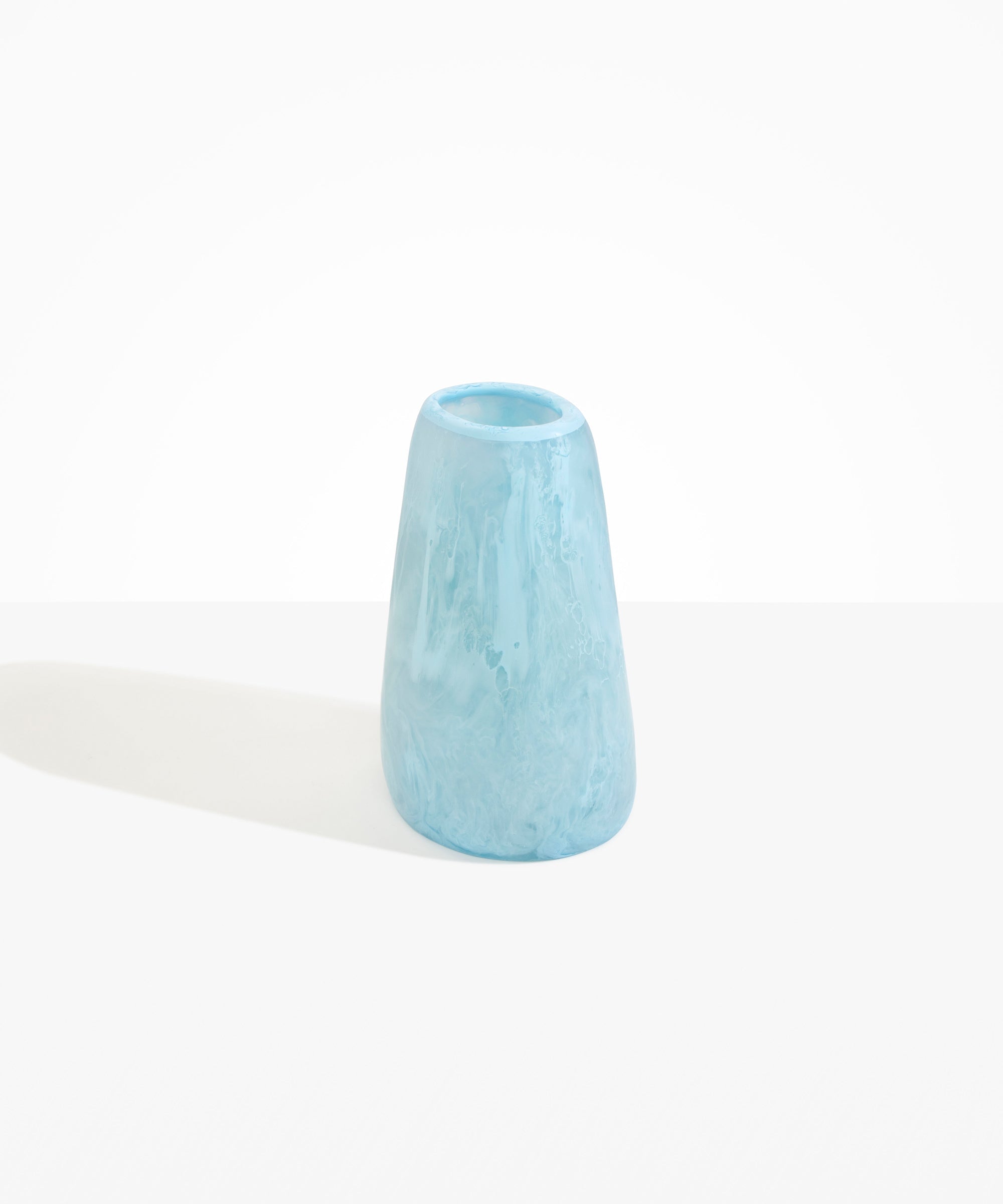 Dinosaur Designs Large Pebble Vase in Pool — handcrafted marbled blue and transparent resin vase with smooth rounded pebble form and narrow opening.