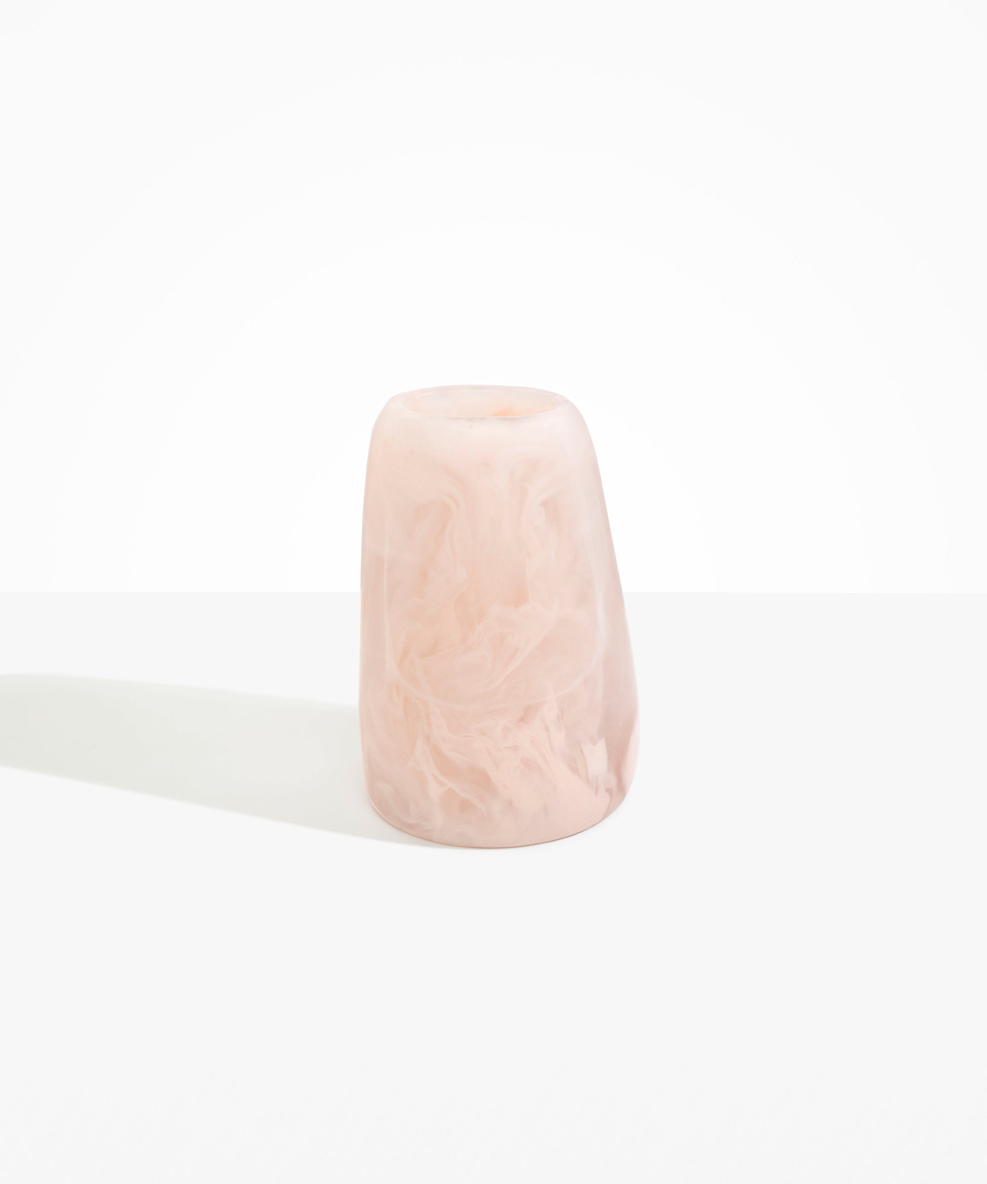 Dinosaur Designs Large Pebble Vase in Rose Swirl — handcrafted marbled pink and transparent resin vase with smooth rounded pebble form and narrow opening..