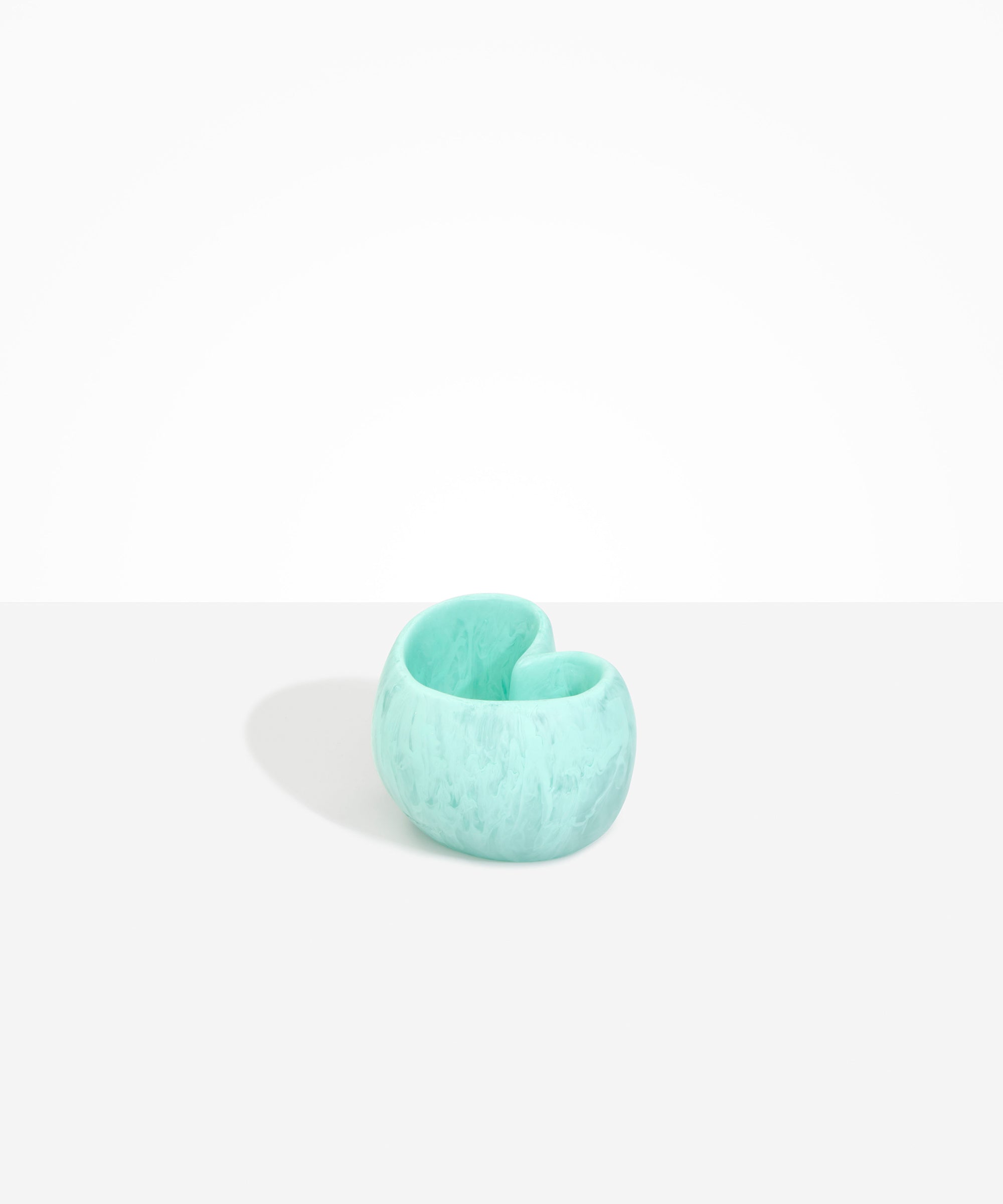 Dinosaur Designs Orchid Vase in Mint — handcrafted marbled mint blue resin vase with short rounded organic form and sculpted open petal-shaped rim