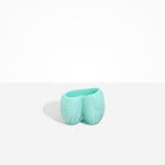 Dinosaur Designs Orchid Vase in Mint — handcrafted marbled mint blue resin vase with short rounded organic form and sculpted open petal-shaped rim