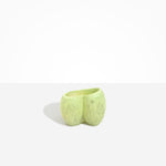 Dinosaur Designs Orchid Vase in Pistachio — handcrafted marbled pastel green resin vase with short rounded organic form and sculpted open petal-shaped rim