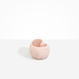 Dinosaur Designs Orchid Vase in Rose Swirl — handcrafted marbled dusty pink resin vase with short rounded organic form and sculpted open petal-shaped rim