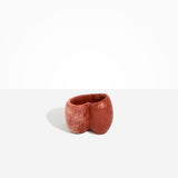 Dinosaur Designs Orchid Vase in Rust — handcrafted marbled terracotta red and cream resin vase with short rounded organic form and sculpted open petal-shaped rim