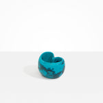 Dinosaur Designs Orchid Vase in Turquoise — handcrafted marbled teal blue resin vase with short rounded organic form and sculpted open petal-shaped rim