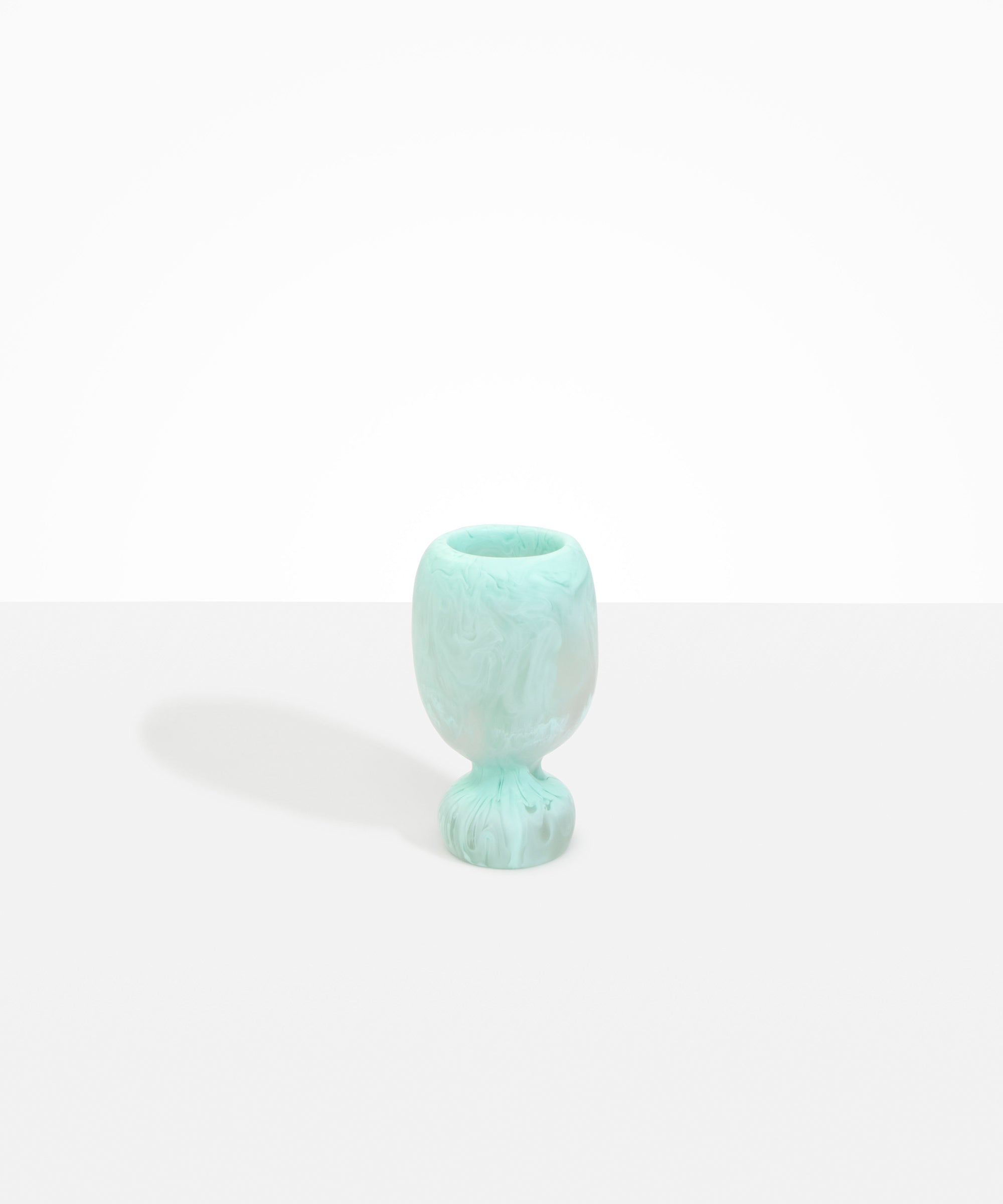 Dinosaur Designs Small Rockpool Vase in Mint — handcrafted marbled mint blue resin vase with rounded bulbous body and small spherical pedestal base