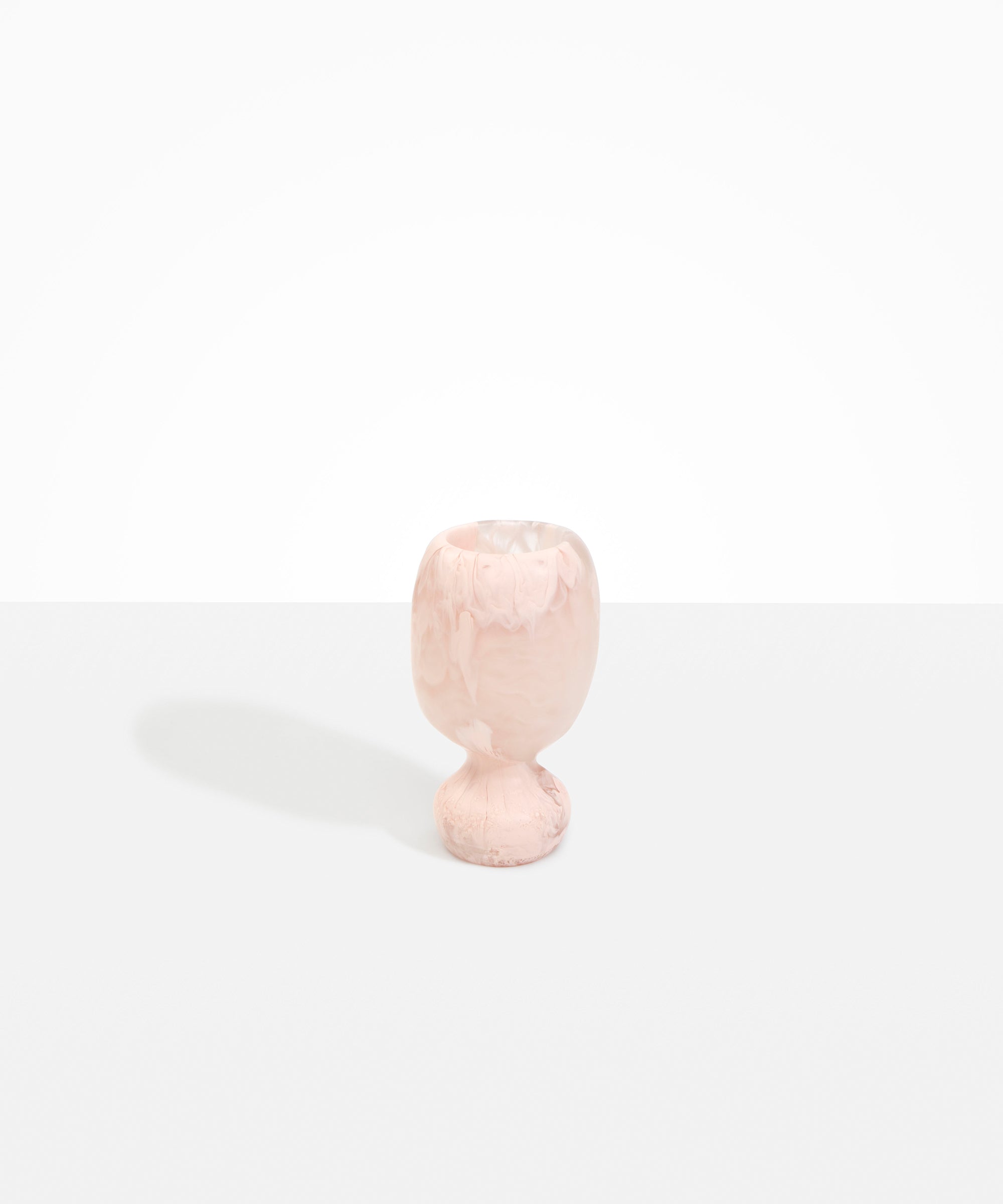 Dinosaur Designs Small Rockpool Vase in Rose Swirl — handcrafted marbled dusty pink resin vase with rounded bulbous body and small spherical pedestal base