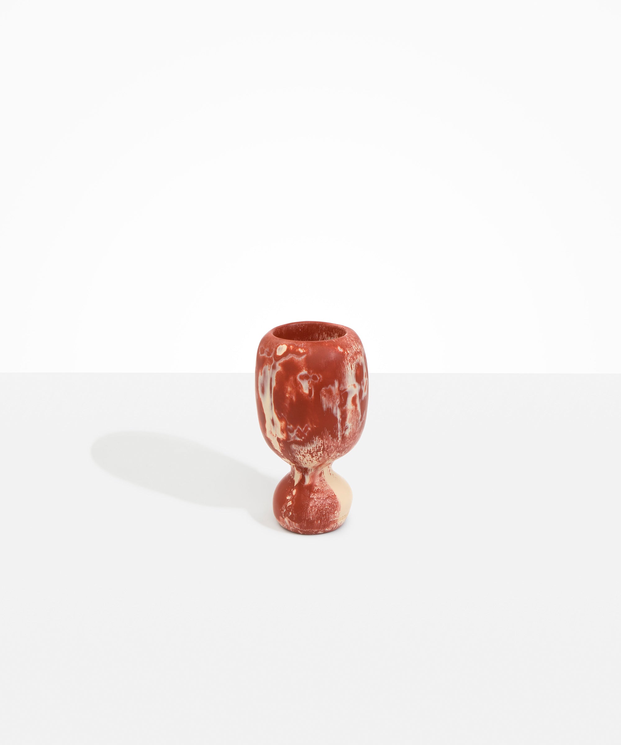 Dinosaur Designs Small Rockpool Vase in Rust — handcrafted marbled terracotta red and cream resin vase with rounded bulbous body and small spherical pedestal base
