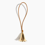 Dinosaur Designs Metal Flower Wind Chime in Brass — polished brass cast flower-shaped decorative wind chime with tan leather hanging loop