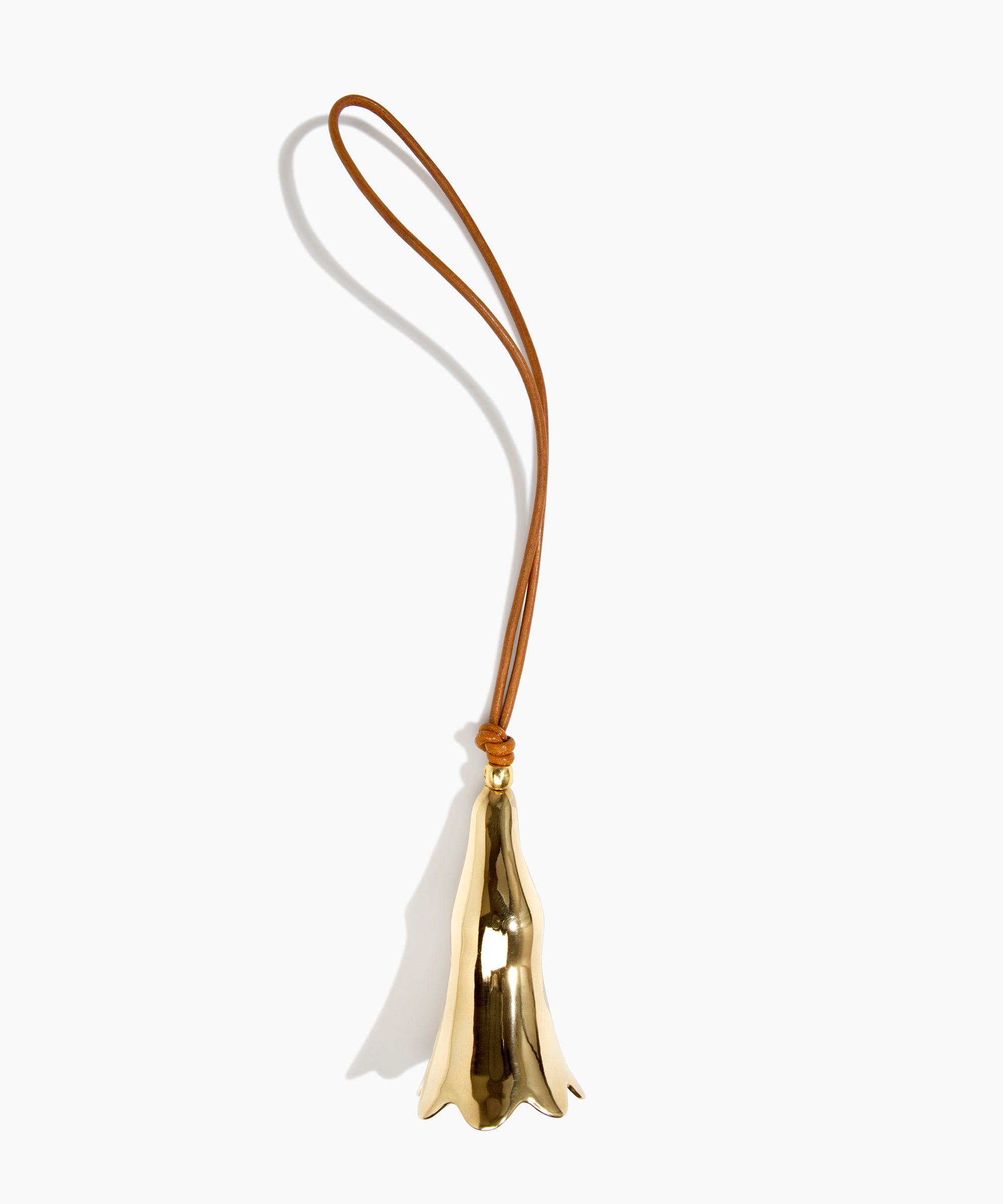 Dinosaur Designs Metal Flower Wind Chime in Brass — polished brass cast flower-shaped decorative wind chime with tan leather hanging loop