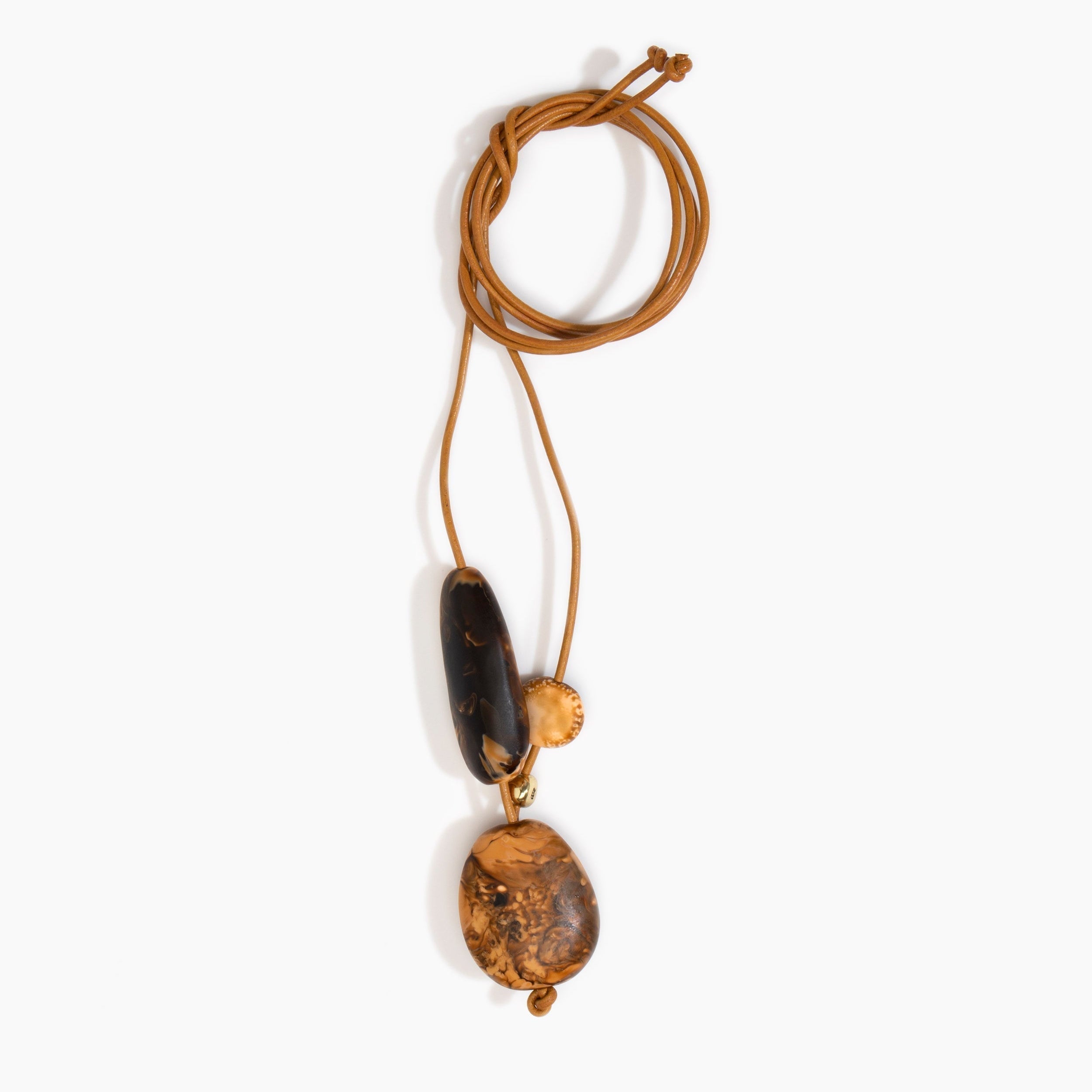 Dinosaur Designs Rock Cluster Pendant in Dark Horn Colour resin with Nano-Coated Brass Bead Material.