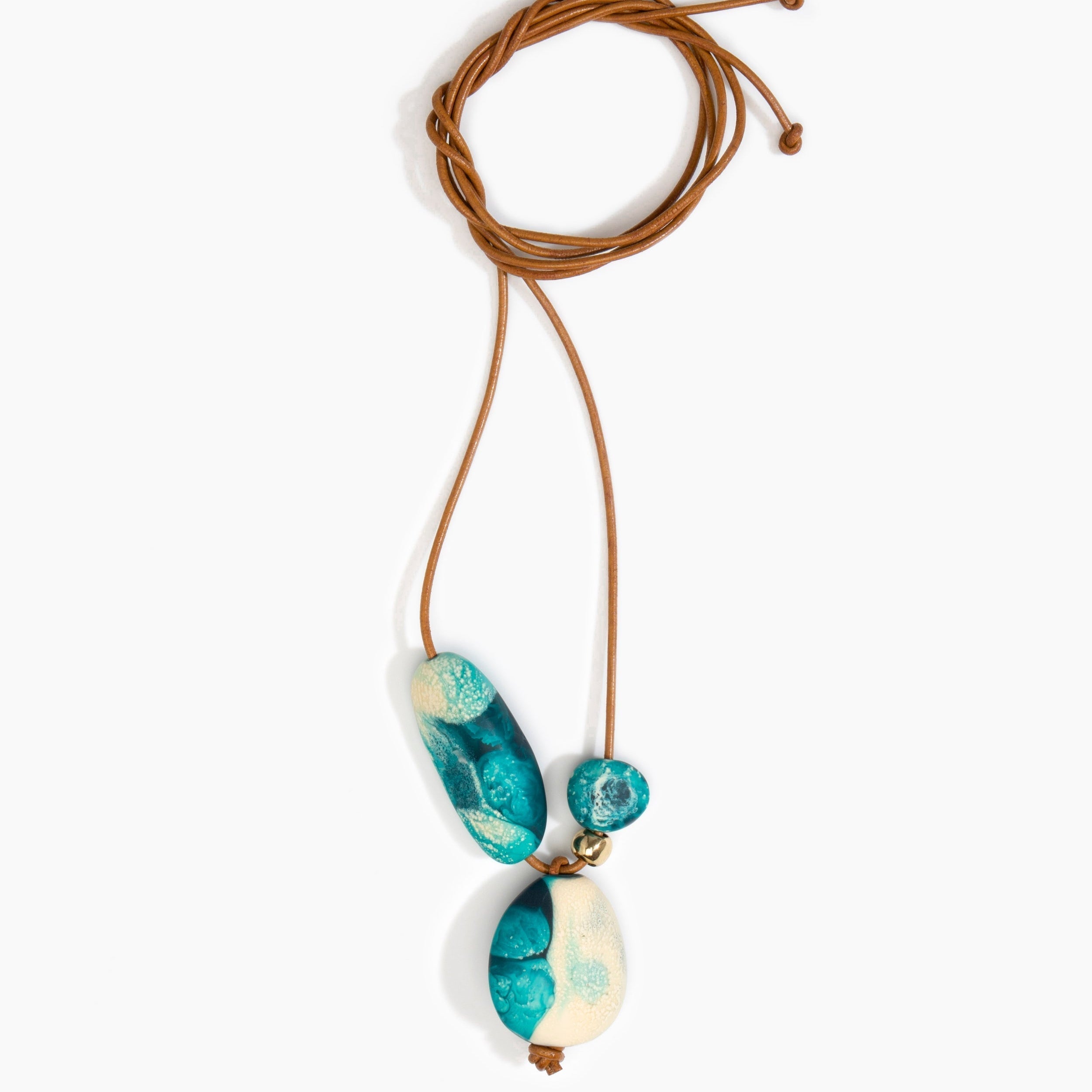 Dinosaur Designs Rock Cluster Pendant in Lagoon Colour resin with Nano-Coated Brass Bead Material.