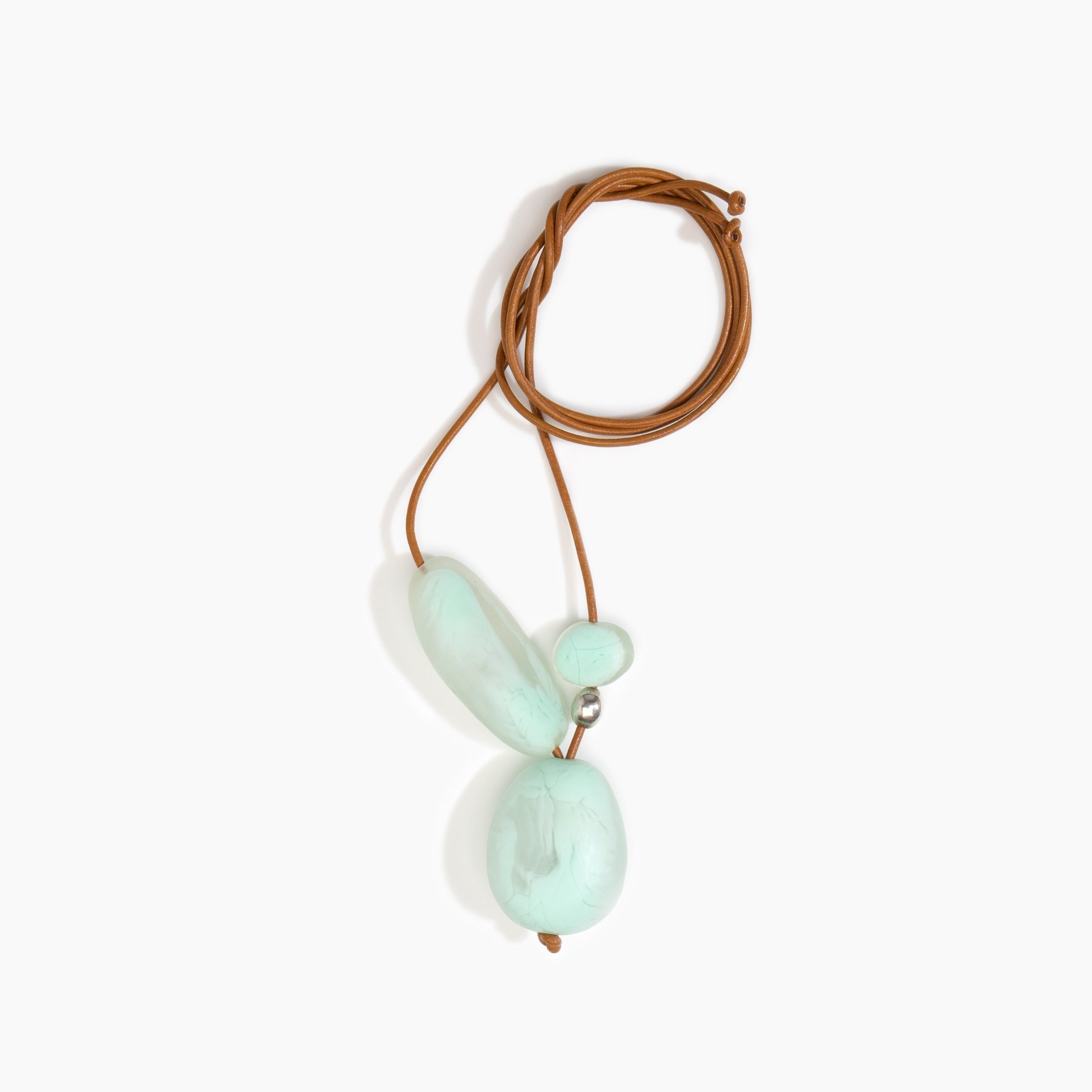 Dinosaur Designs Rock Cluster Pendant in Mint Colour resin with Nano-Coated Brass Bead Material.