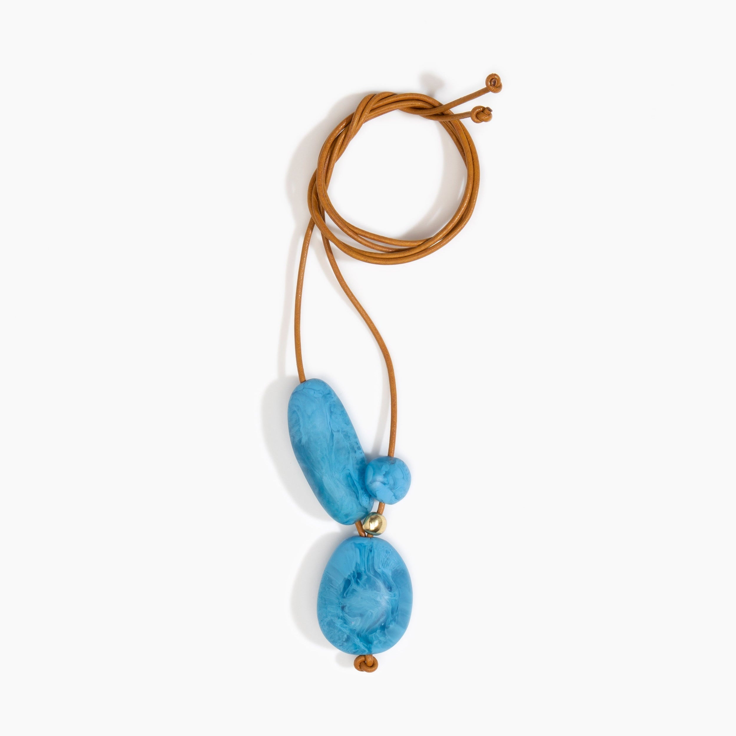 Dinosaur Designs Rock Cluster Pendant in Sky Colour resin with Nano-Coated Brass Bead Material.
