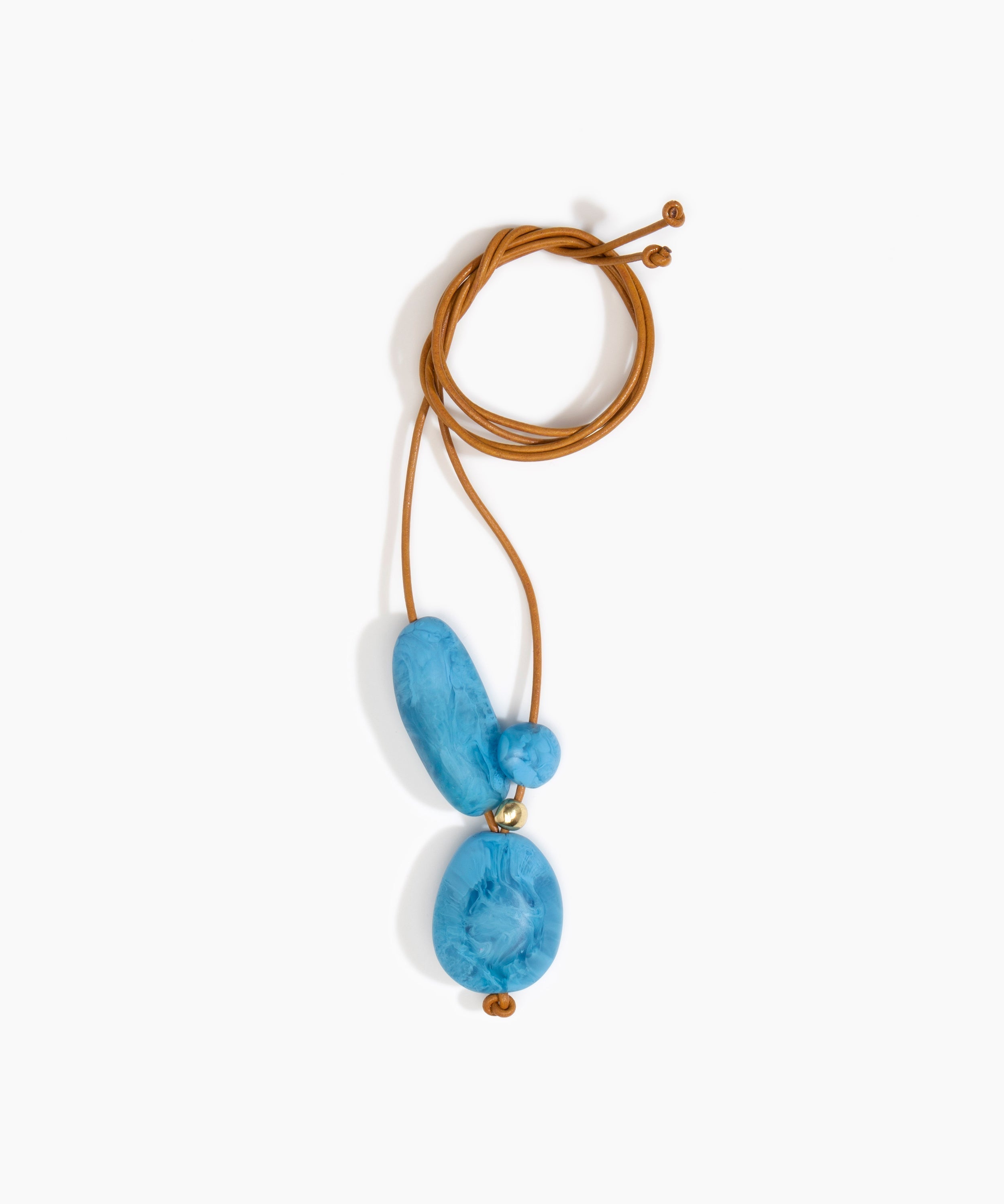 Dinosaur Designs Rock Cluster Pendant in Sky Colour resin with Nano-Coated Brass Bead Material.