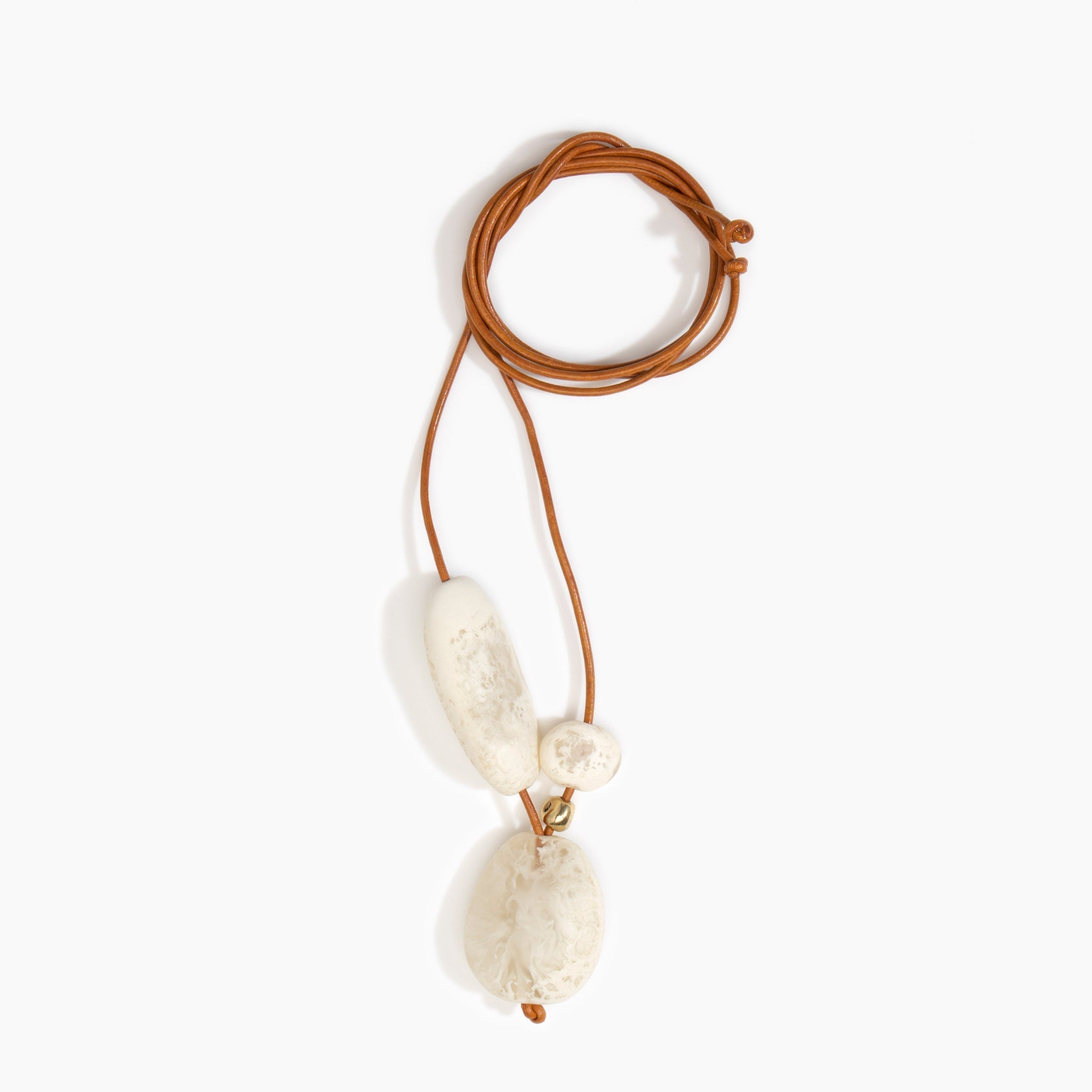 Dinosaur Designs Rock Cluster Pendant in Chalk Swirl Colour resin with Nano-Coated Brass Bead Material.