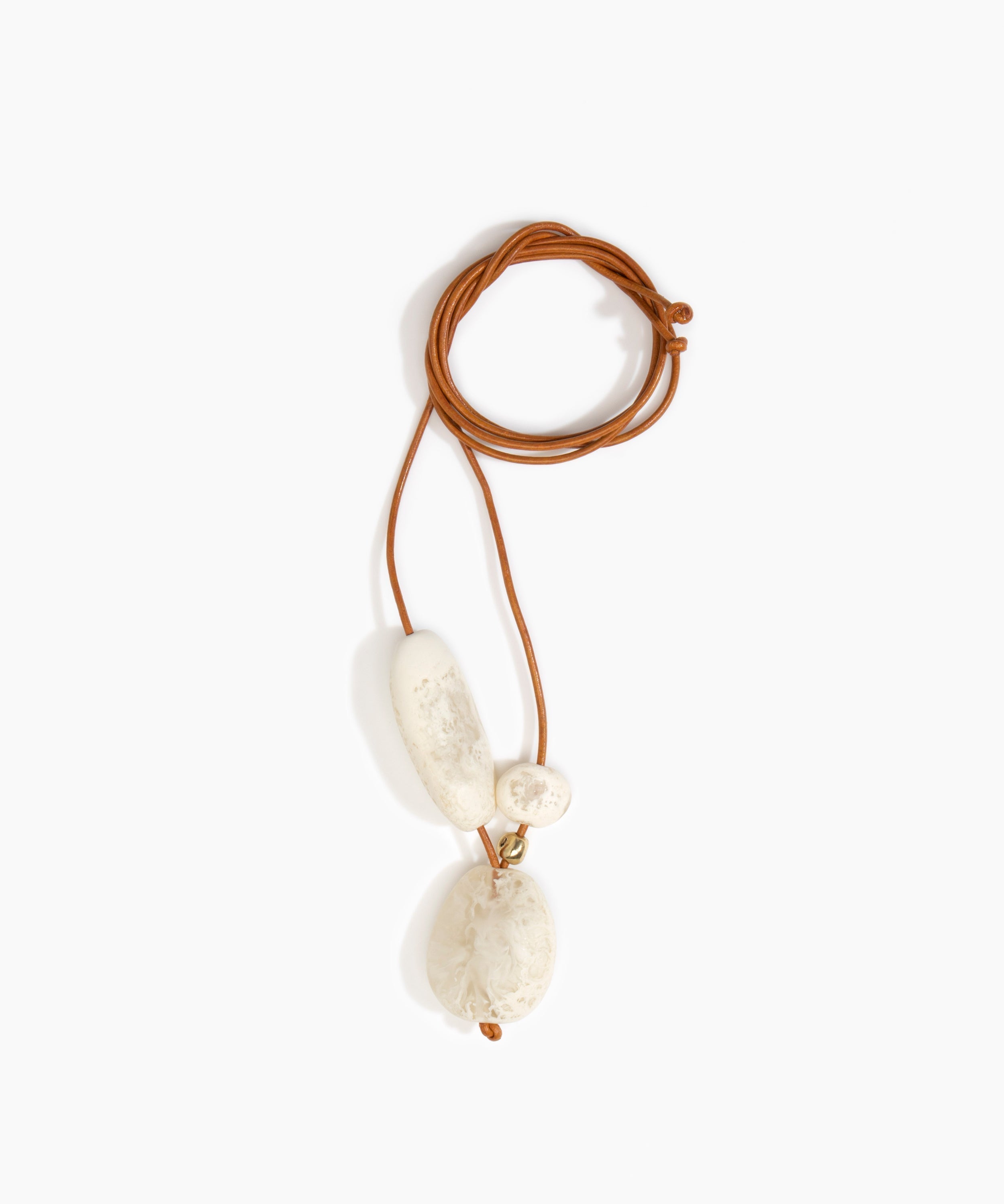 Dinosaur Designs Rock Cluster Pendant in Chalk Swirl Colour resin with Nano-Coated Brass Bead Material.
