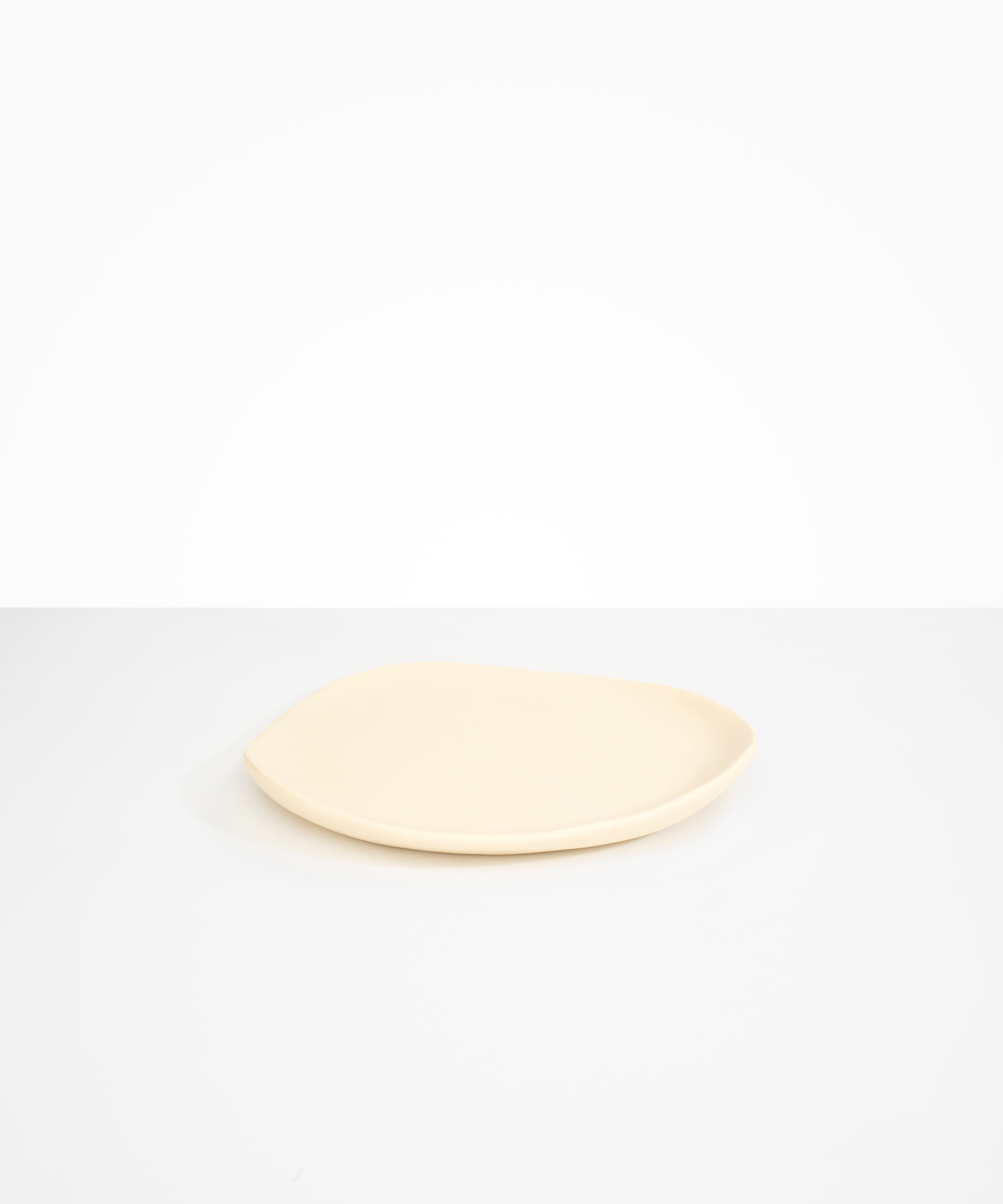 Dinosaur Designs Pebble Plate in Cream Colour resin.