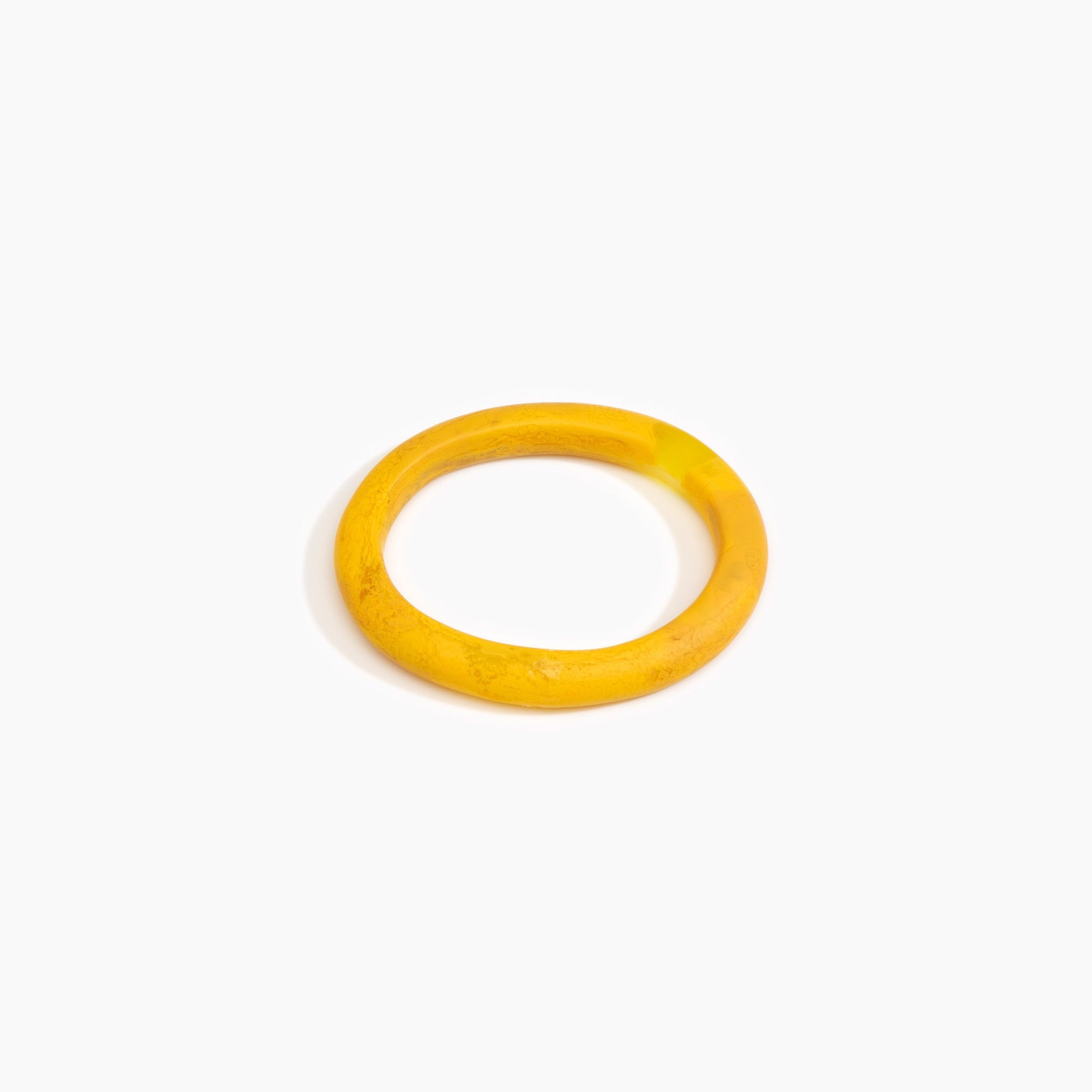 Dinosaur Designs Small Organic Oval Bangle in Honeycomb Colour resin with Wide Fit.