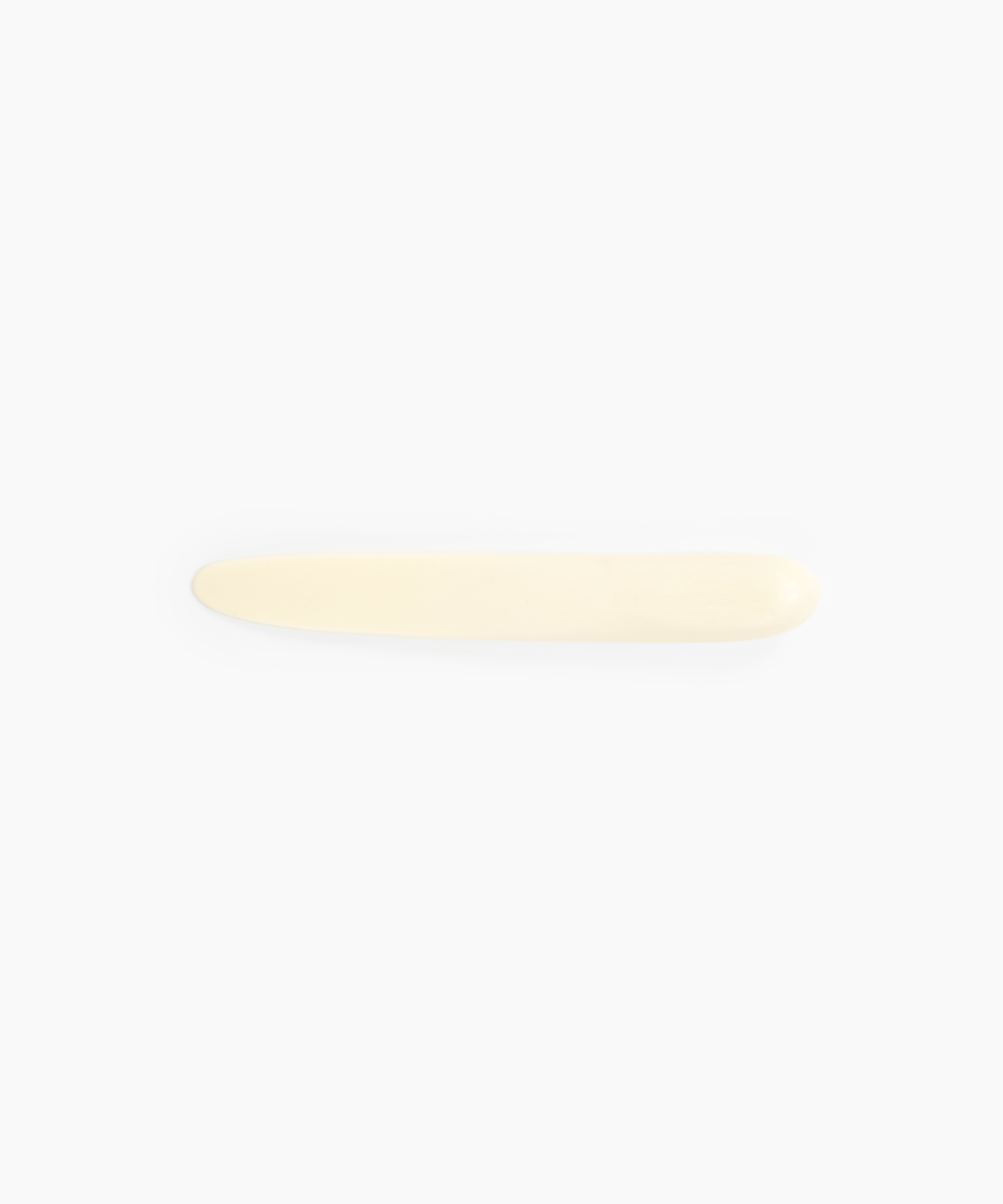Dinosaur Designs Stone Cheese Knife in Cream Colour resin.