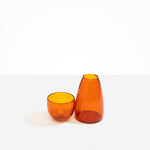 Dinosaur Designs coloured Glass Pebble Carafe cup and jug set in amber orange.