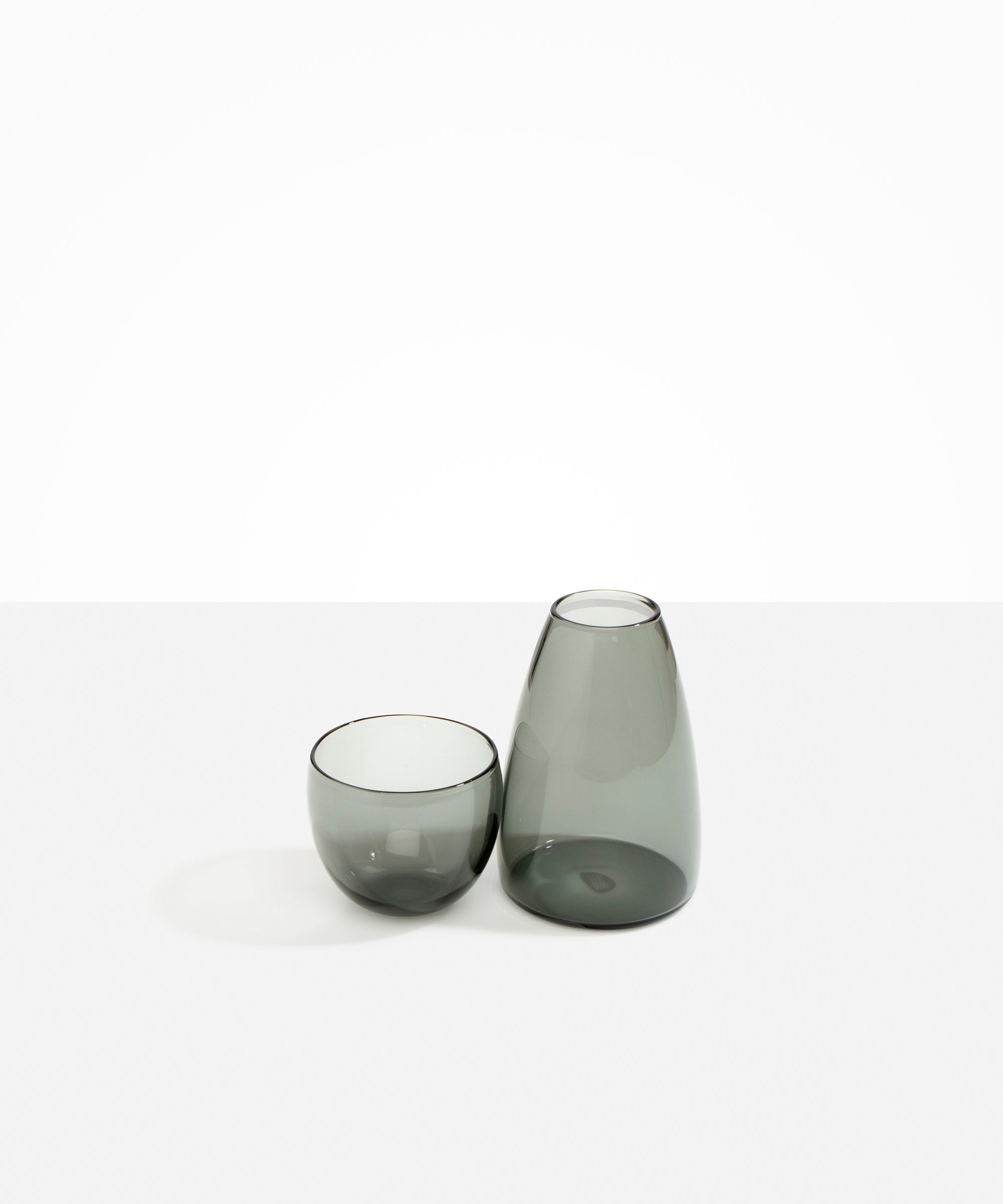 Dinosaur Designs coloured Glass Pebble Carafe cup and jug set in transparent black.