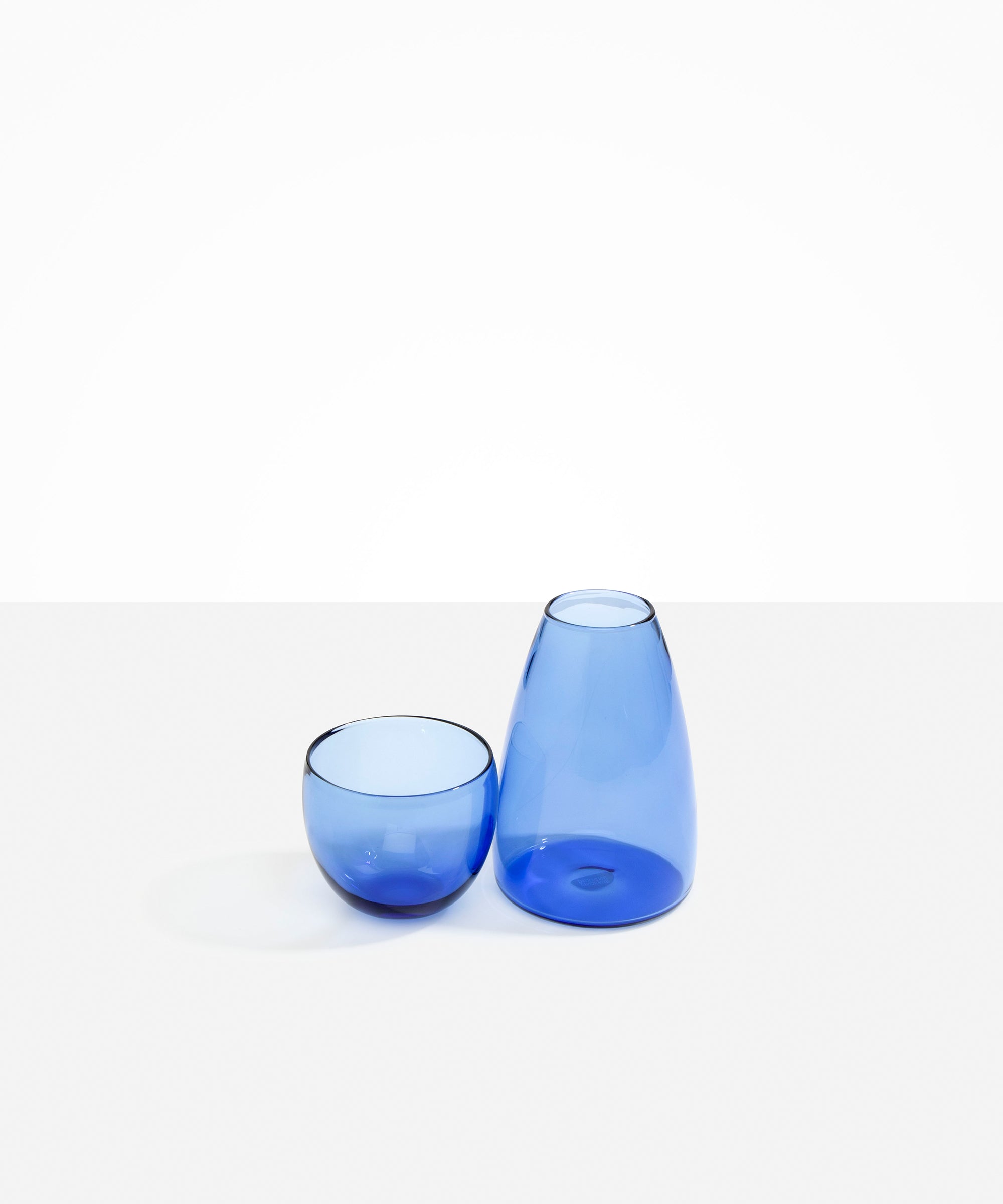 Dinosaur Designs coloured Glass Pebble Carafe cup and jug set in light blue.