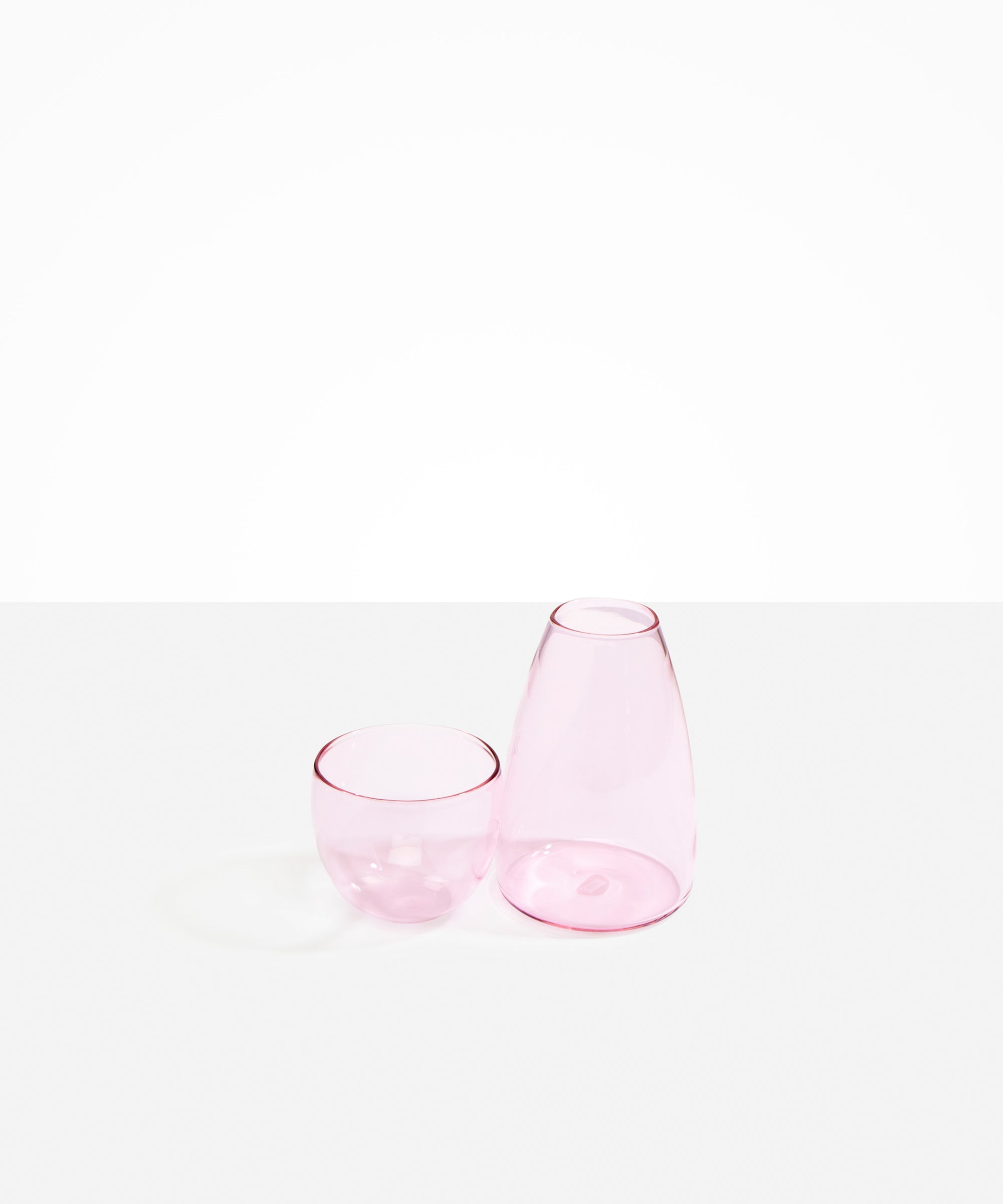 Dinosaur Designs coloured Glass Pebble Carafe cup and jug set in transparent pink.