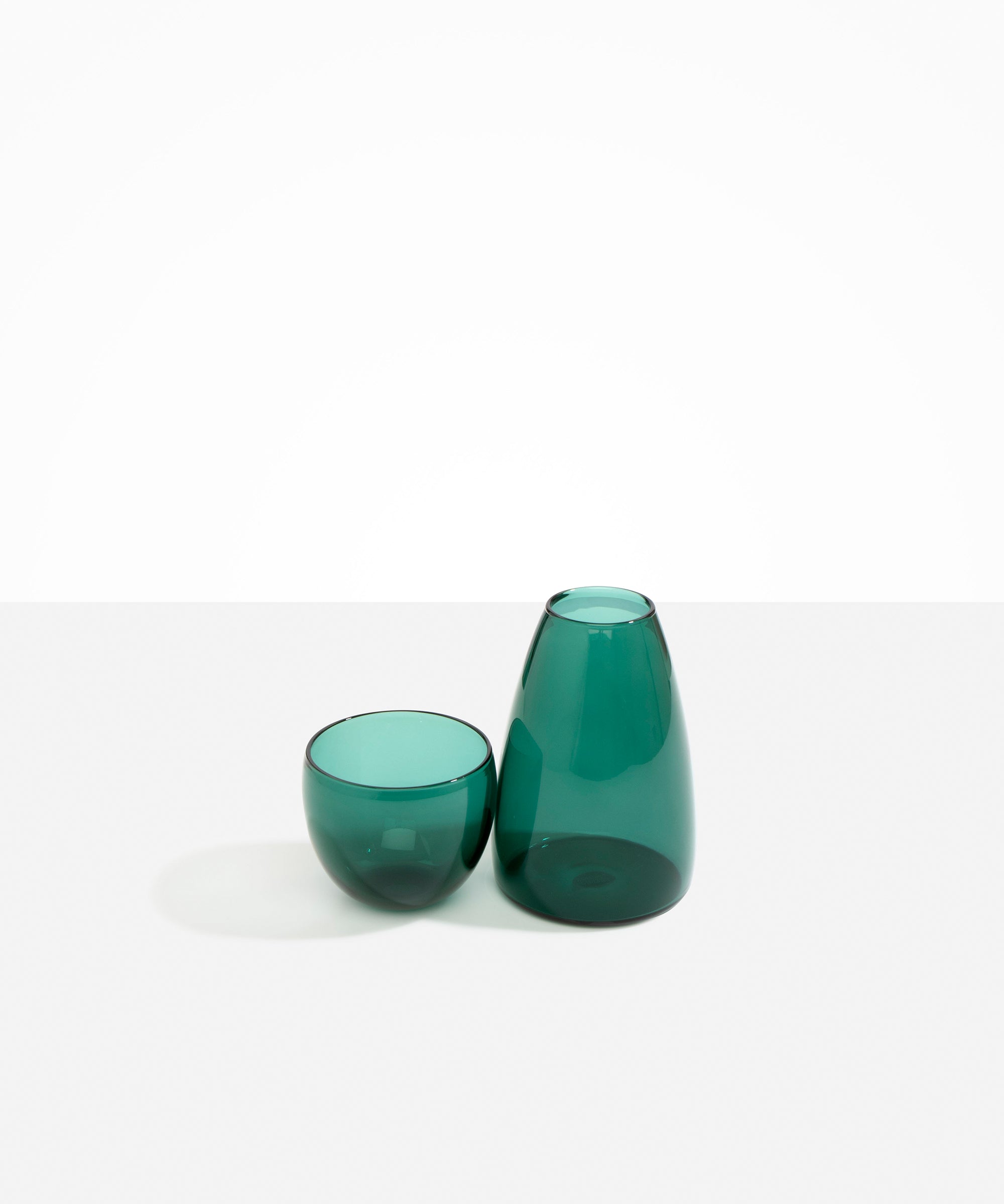 Dinosaur Designs coloured Glass Pebble Carafe cup and jug set in transparent teal green.