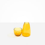 Dinosaur Designs coloured Glass Pebble Carafe cup and jug set in transparent yellow.