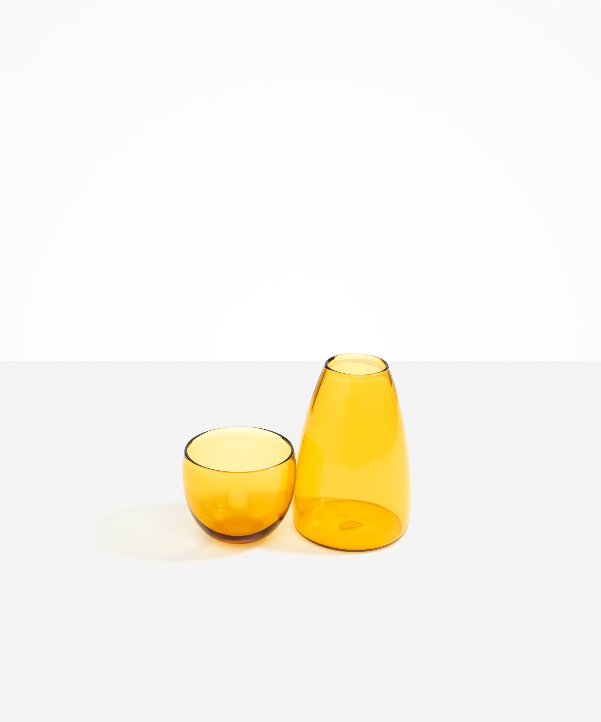 Dinosaur Designs coloured Glass Pebble Carafe cup and jug set in transparent yellow.