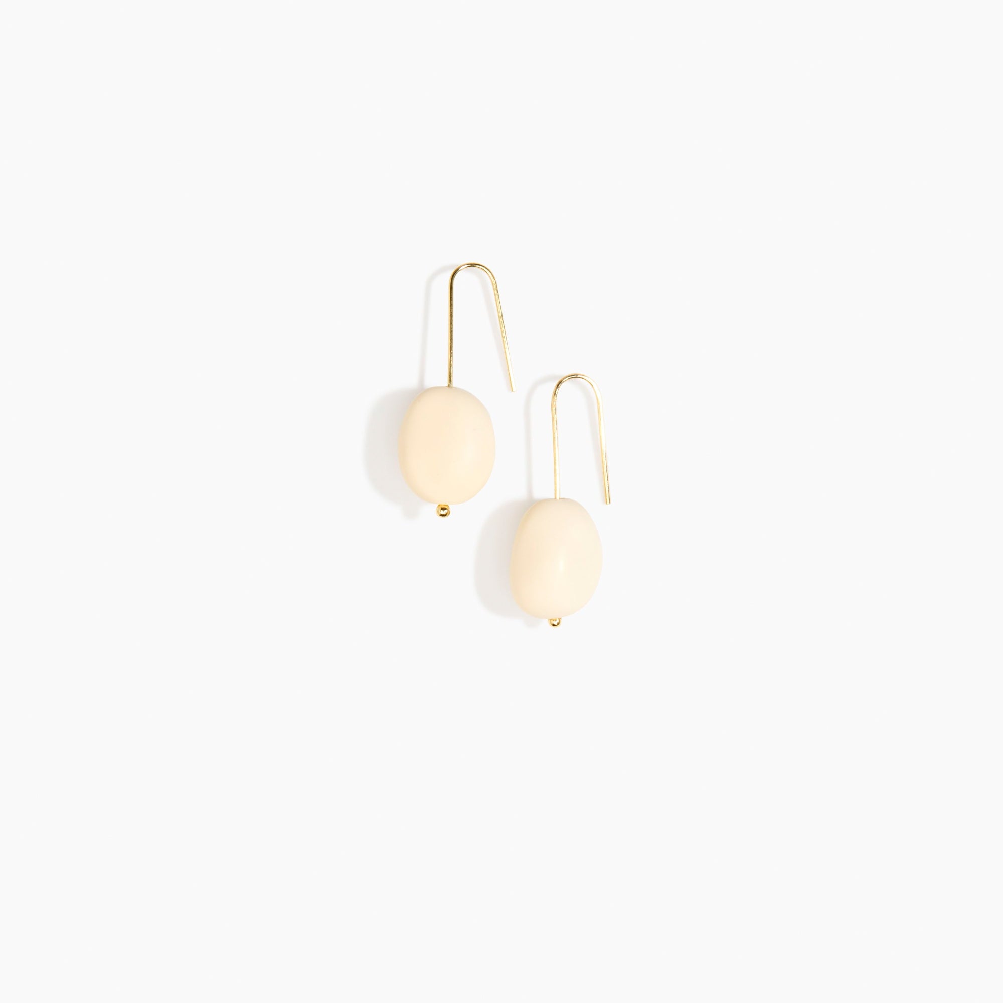 Dinosaur Designs Earth Wire Earrings in Cream Colour resin with Gold-Filled Material.